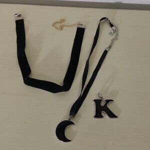 2 choker necklaces one with moon charm, one plain and K charm